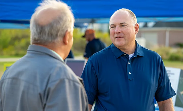 Greg Amburgey speaking with a landowner