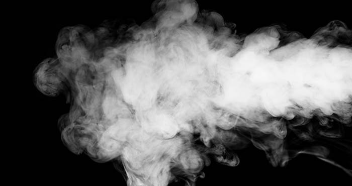 An image of smoke over a white background representing fog rising out of a leaking pipeline
