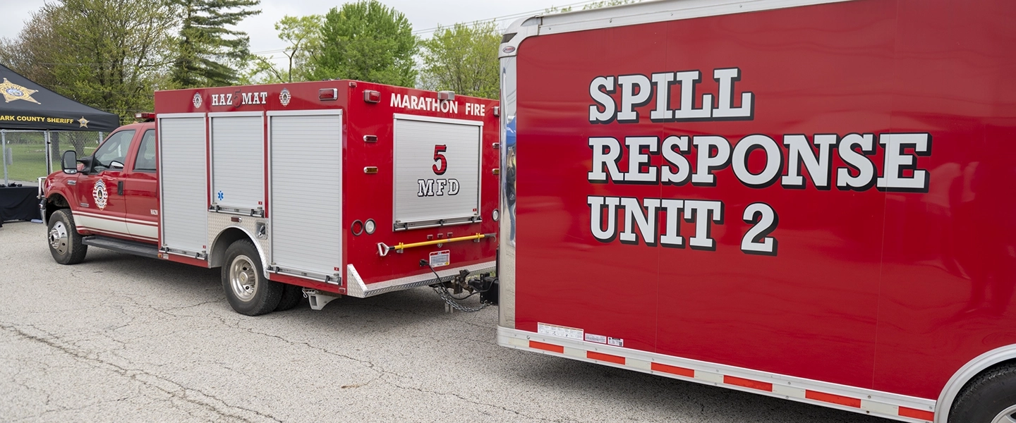 A red Marathon spill response vehicle with a trailer attached