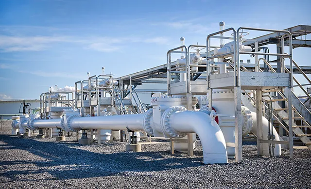 White pipeline terminal pipes above ground